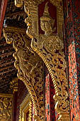 Wat Xieng Thong temple in Luang Prabang, Laos. the Ho Tai, the library. Detail of the console of the roof. 